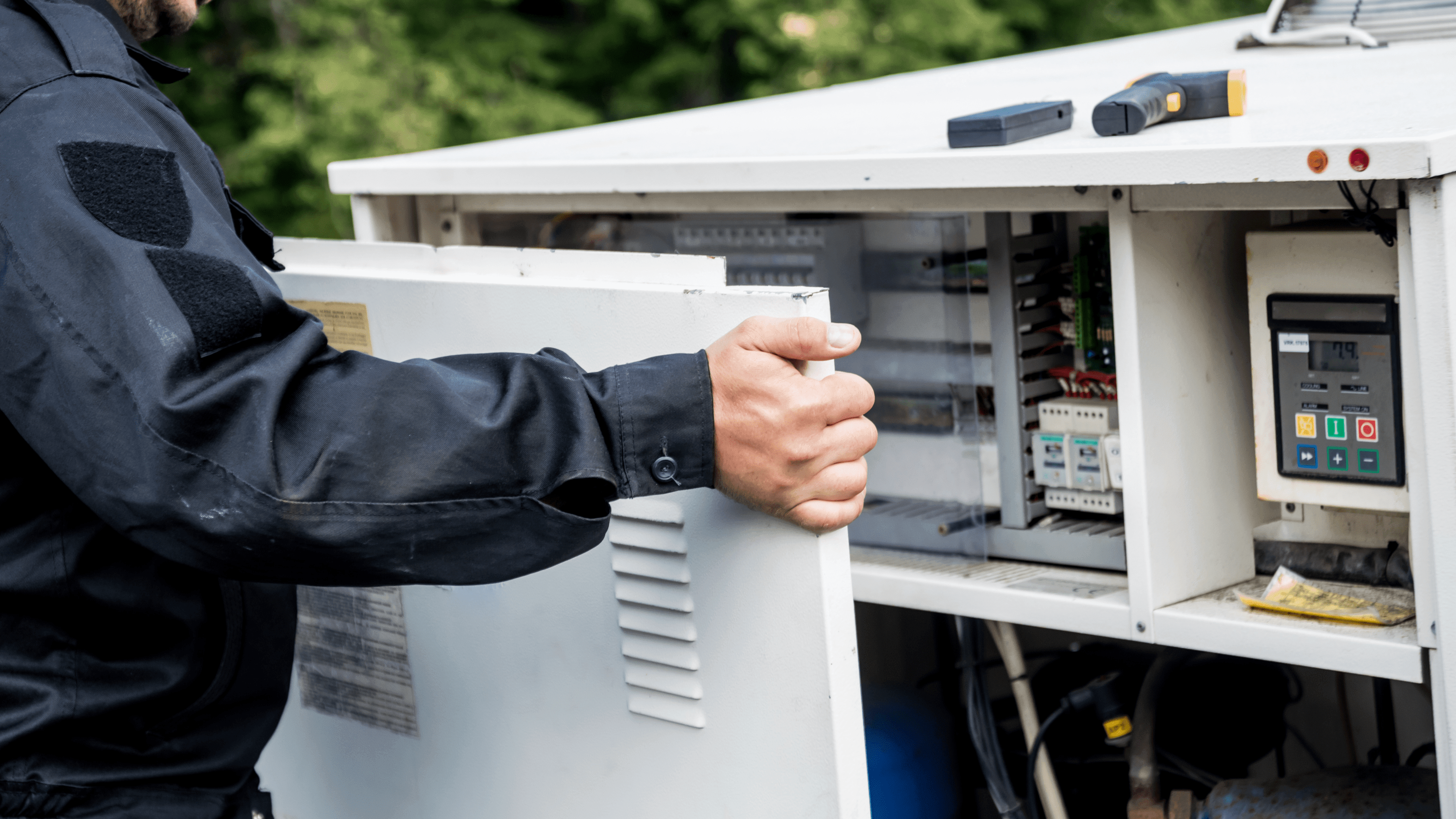 person inspecting hvac for winter