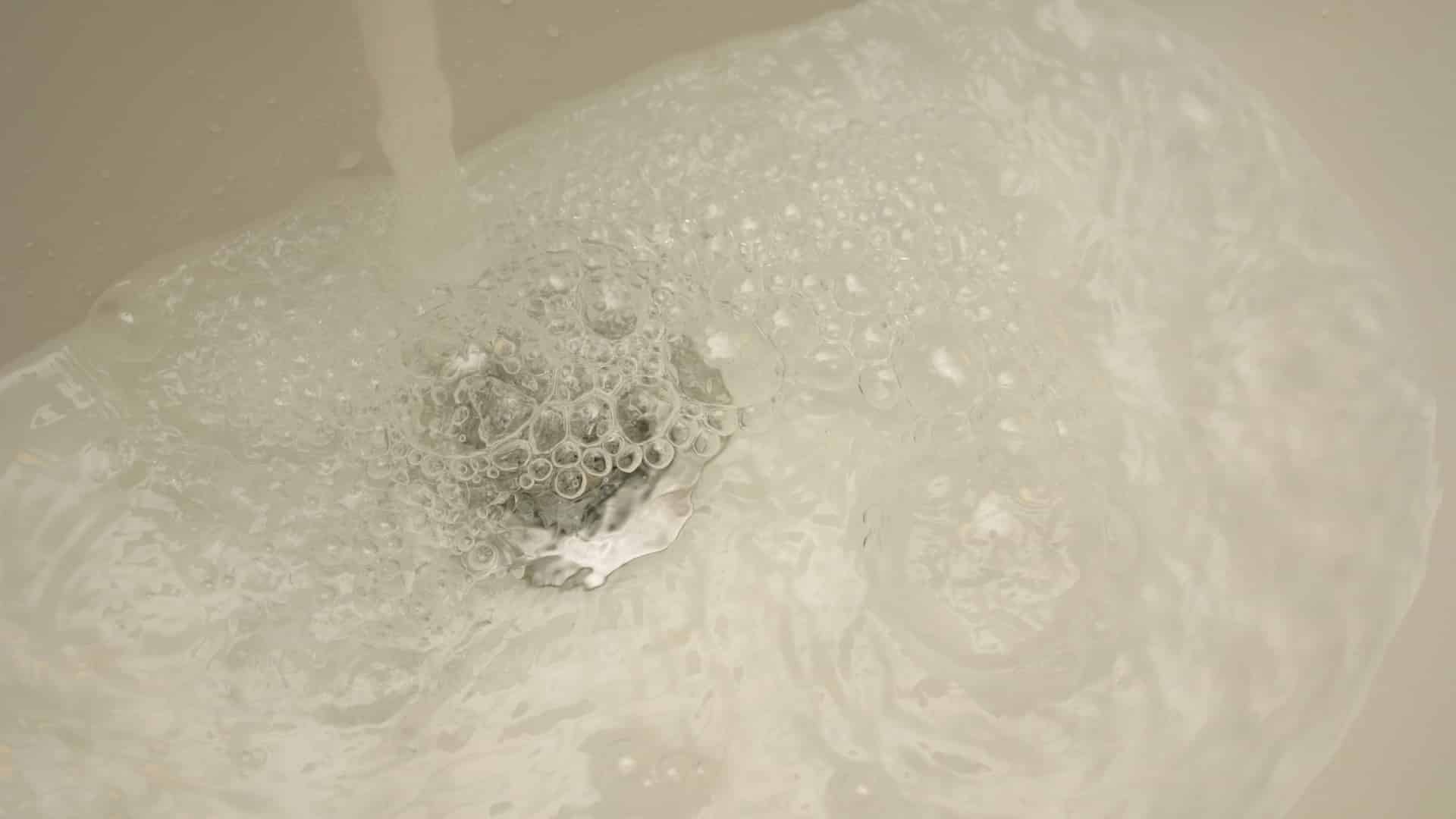 slow drain with water backing up
